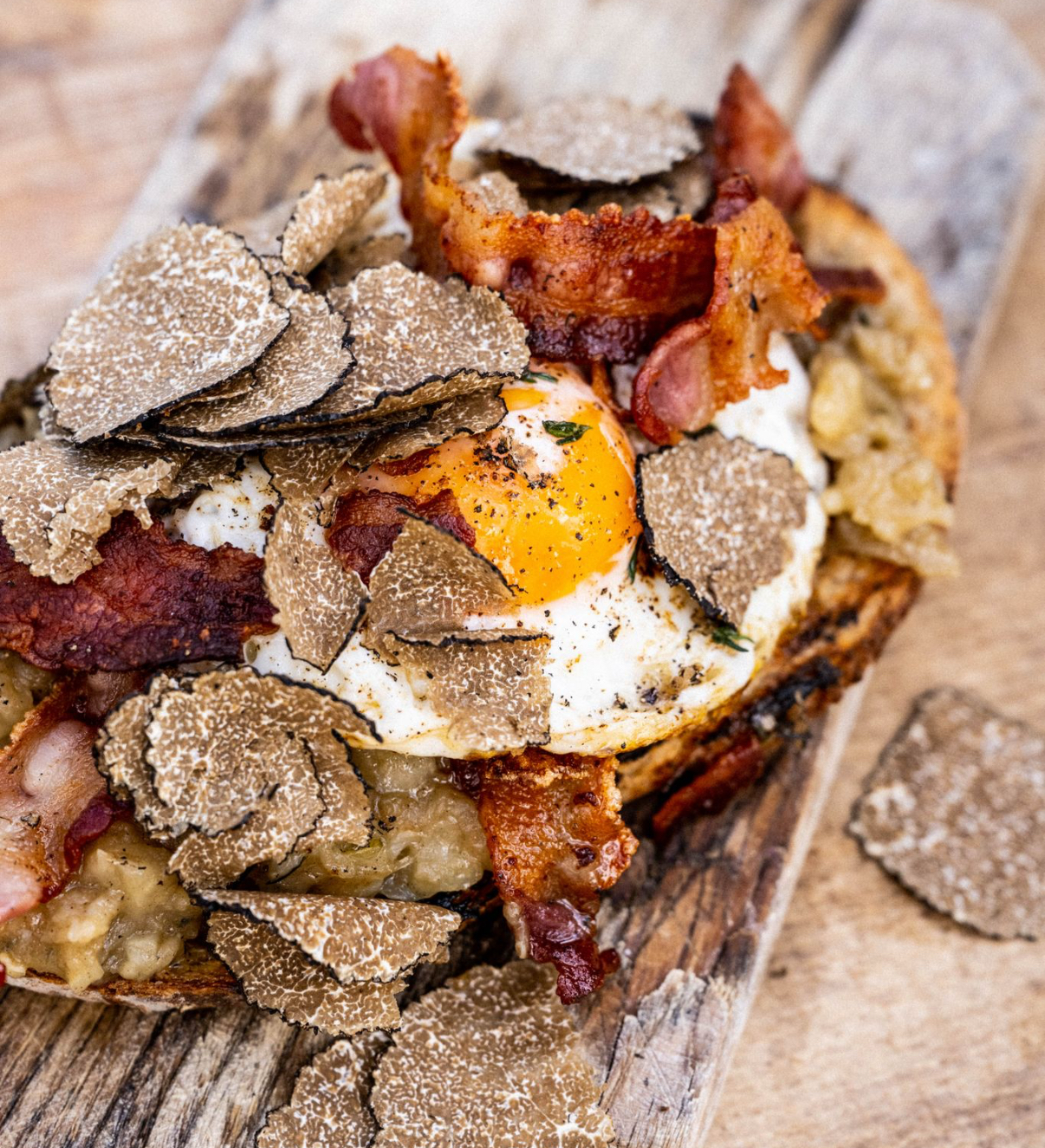 Celeriac on toast with crispy bacon, fried eggs and truffle
