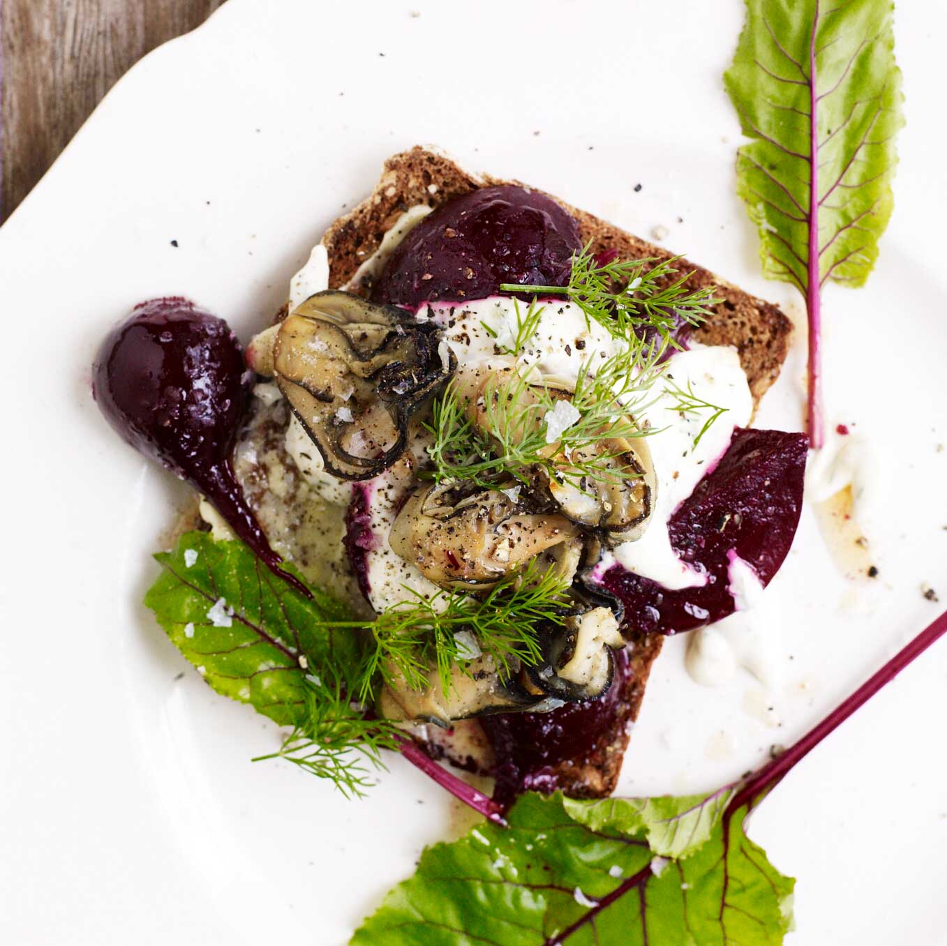 Smoked oysters with beetroot, horseradish, crème fraîche & dill