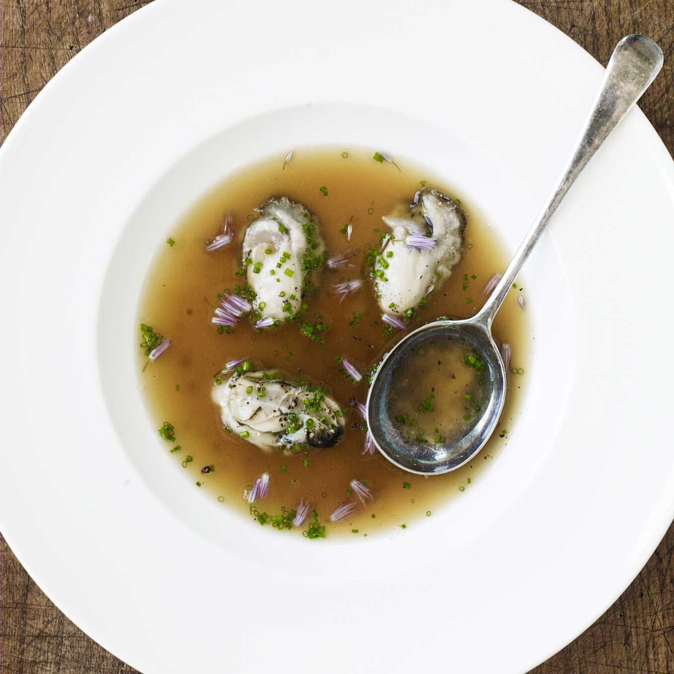 Oysters in chicken stock with chives