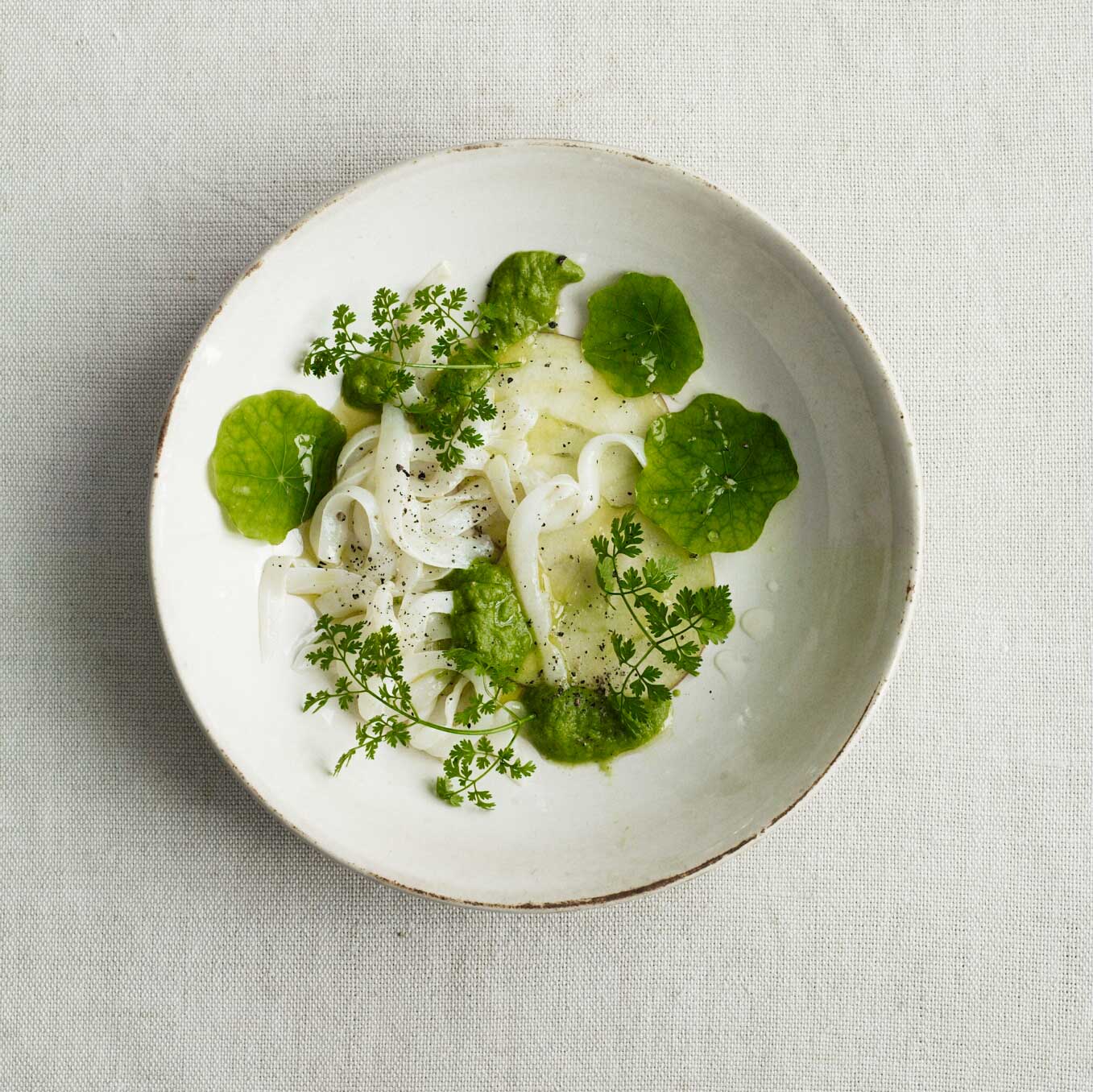 Raw squid with lemon, apple, chervil & nasturtium leaves