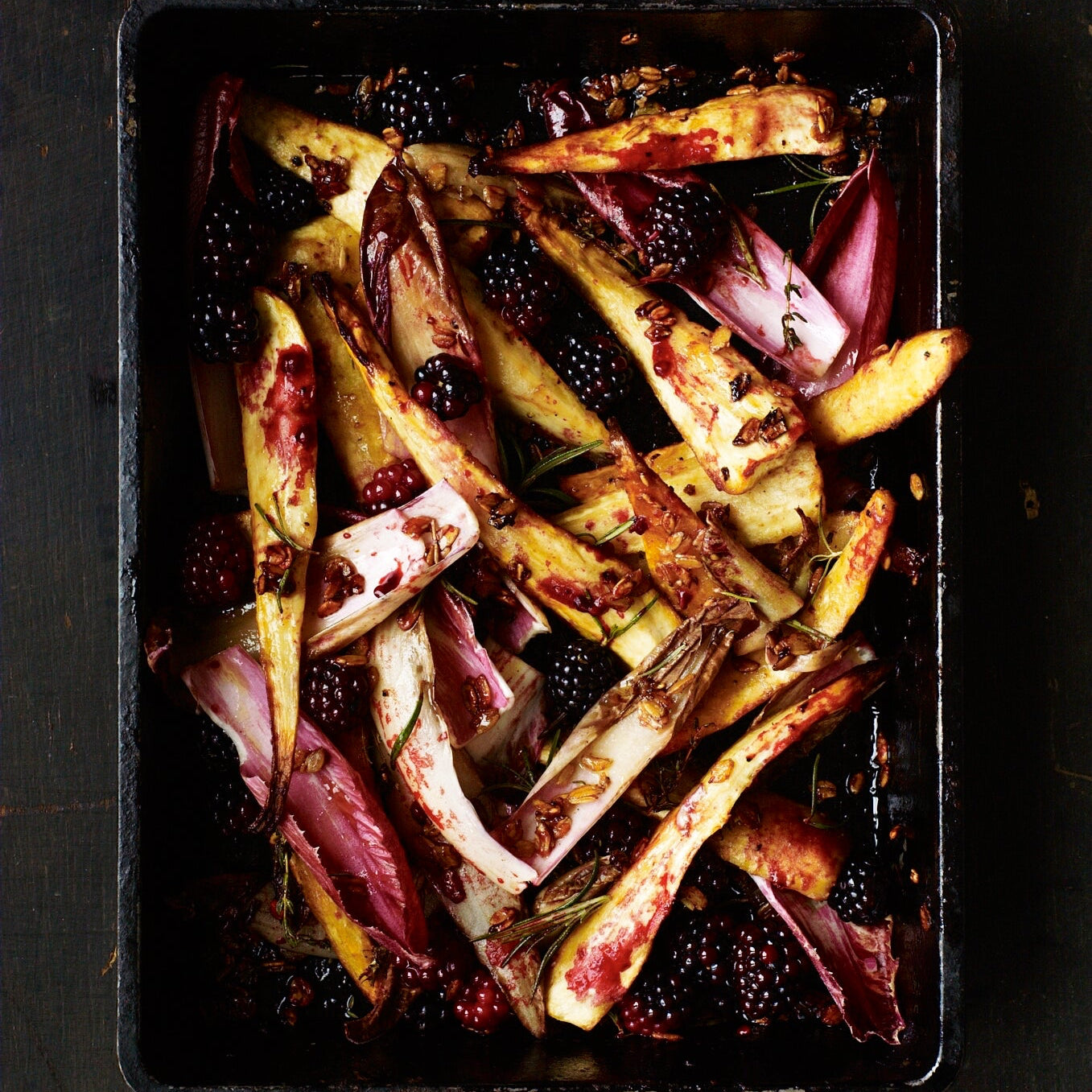 Roast parsnips with blackberries, honey chicory & rye flakes