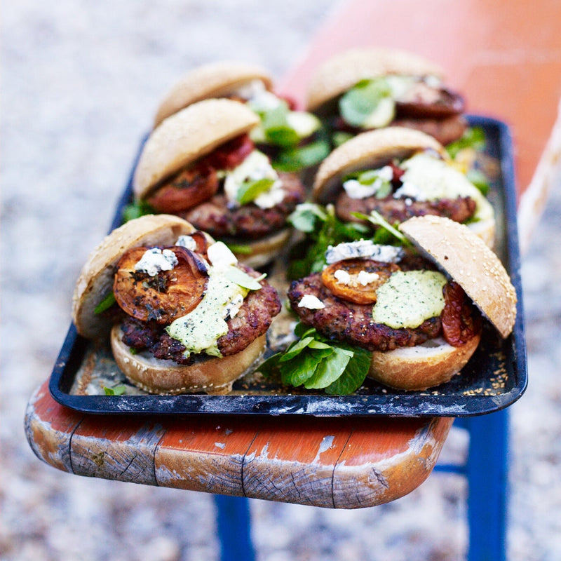 Rabbit burgers with watercress mayonnaise, blue cheese and slow-roast tomatoes