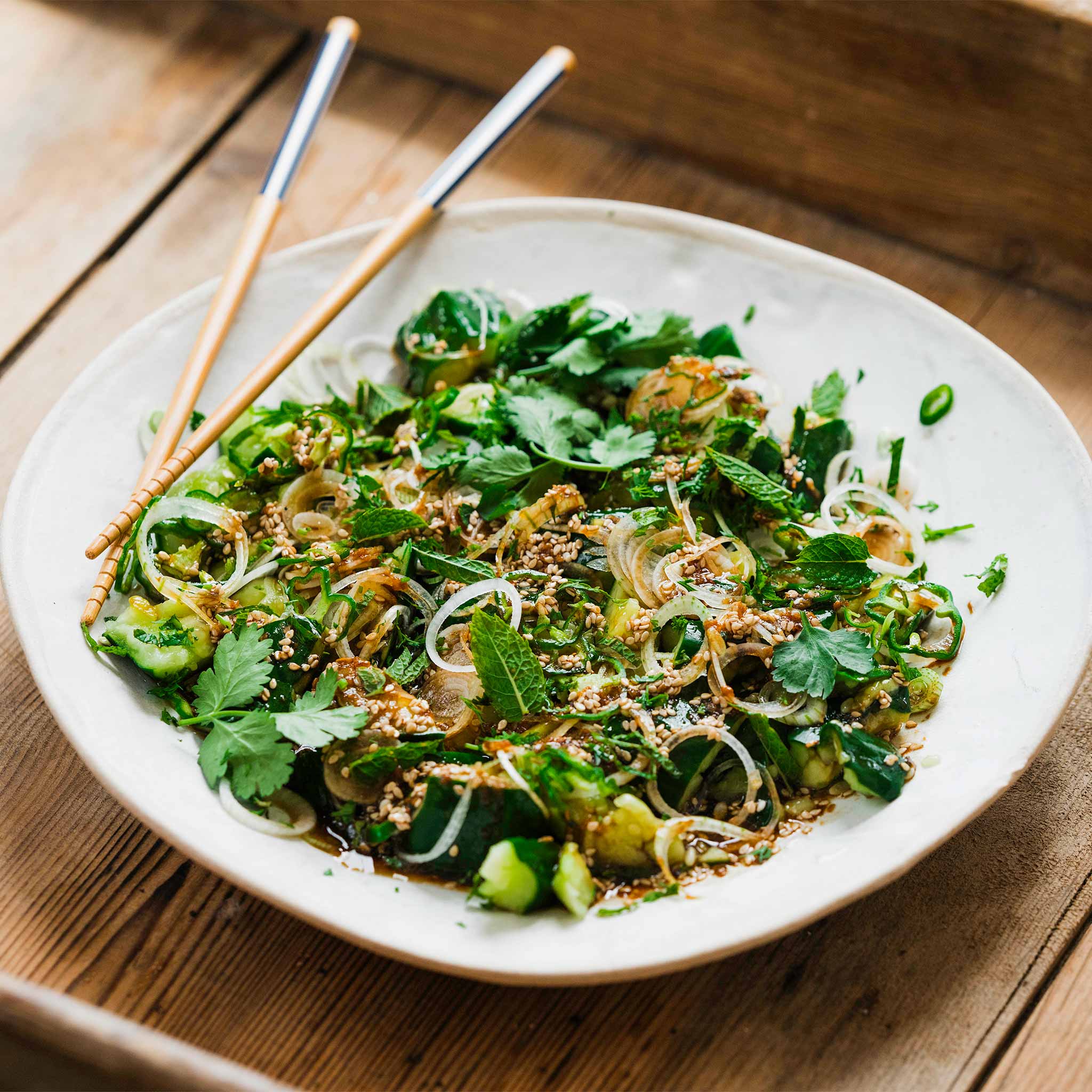 Bashed cucumbers with green chillies, mint and spring onions