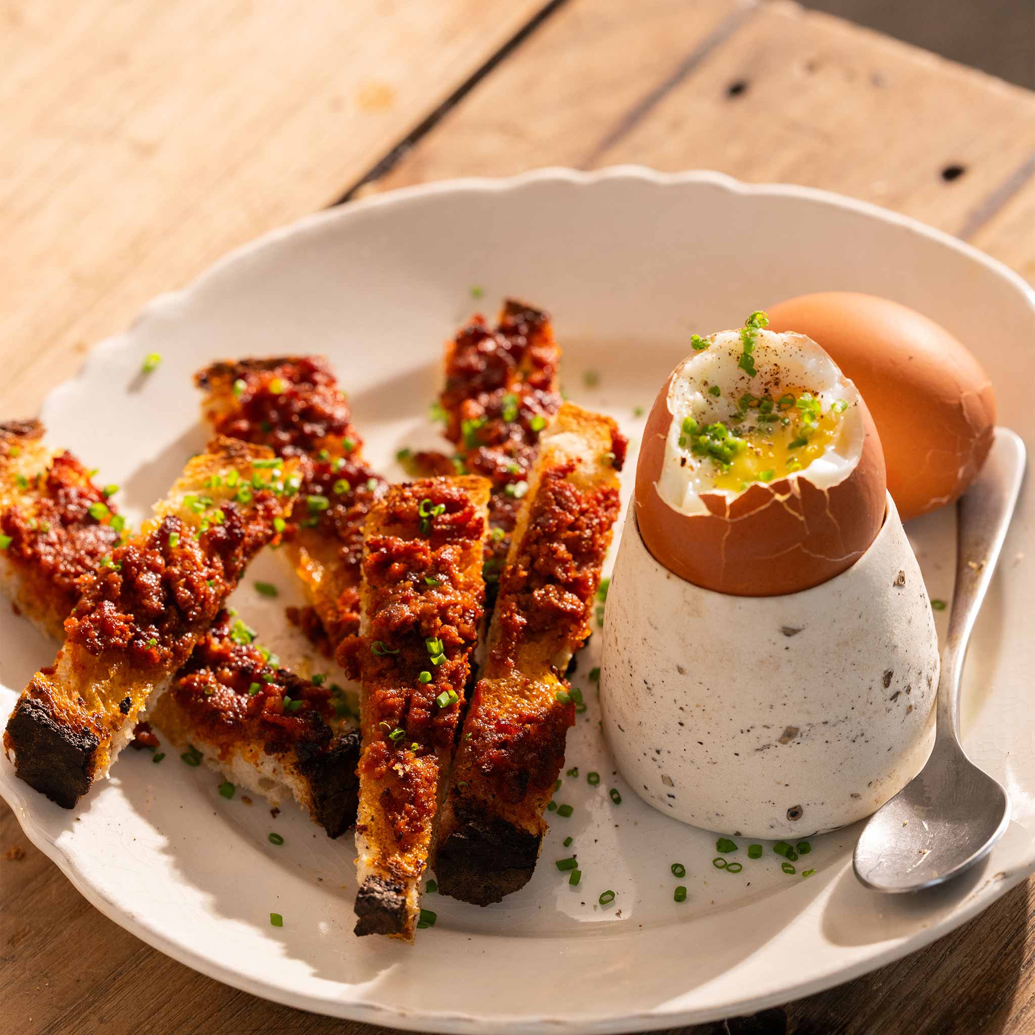 Dippy eggs with spicy nduja soldiers