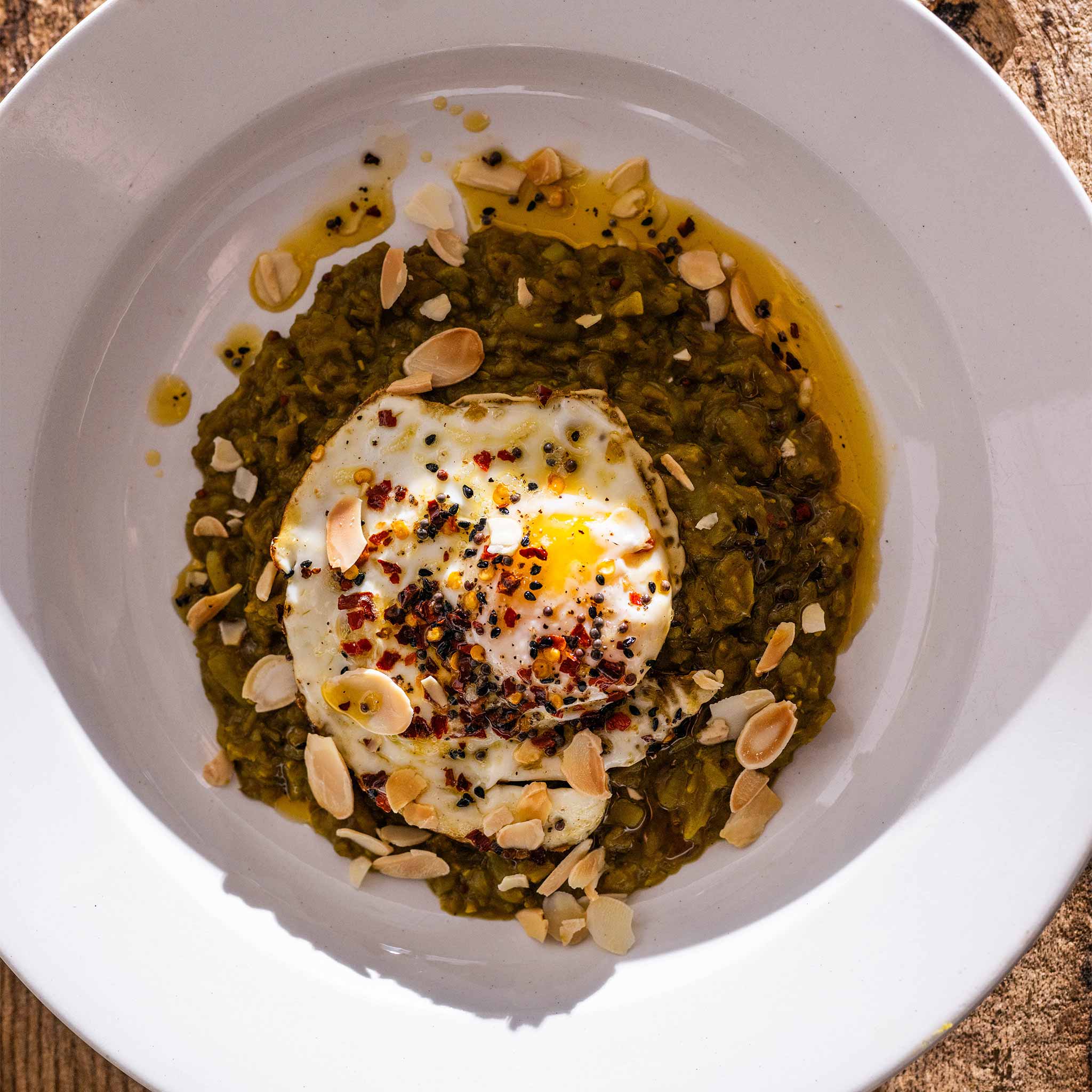 Warming lentil dahl with spiced fried eggs