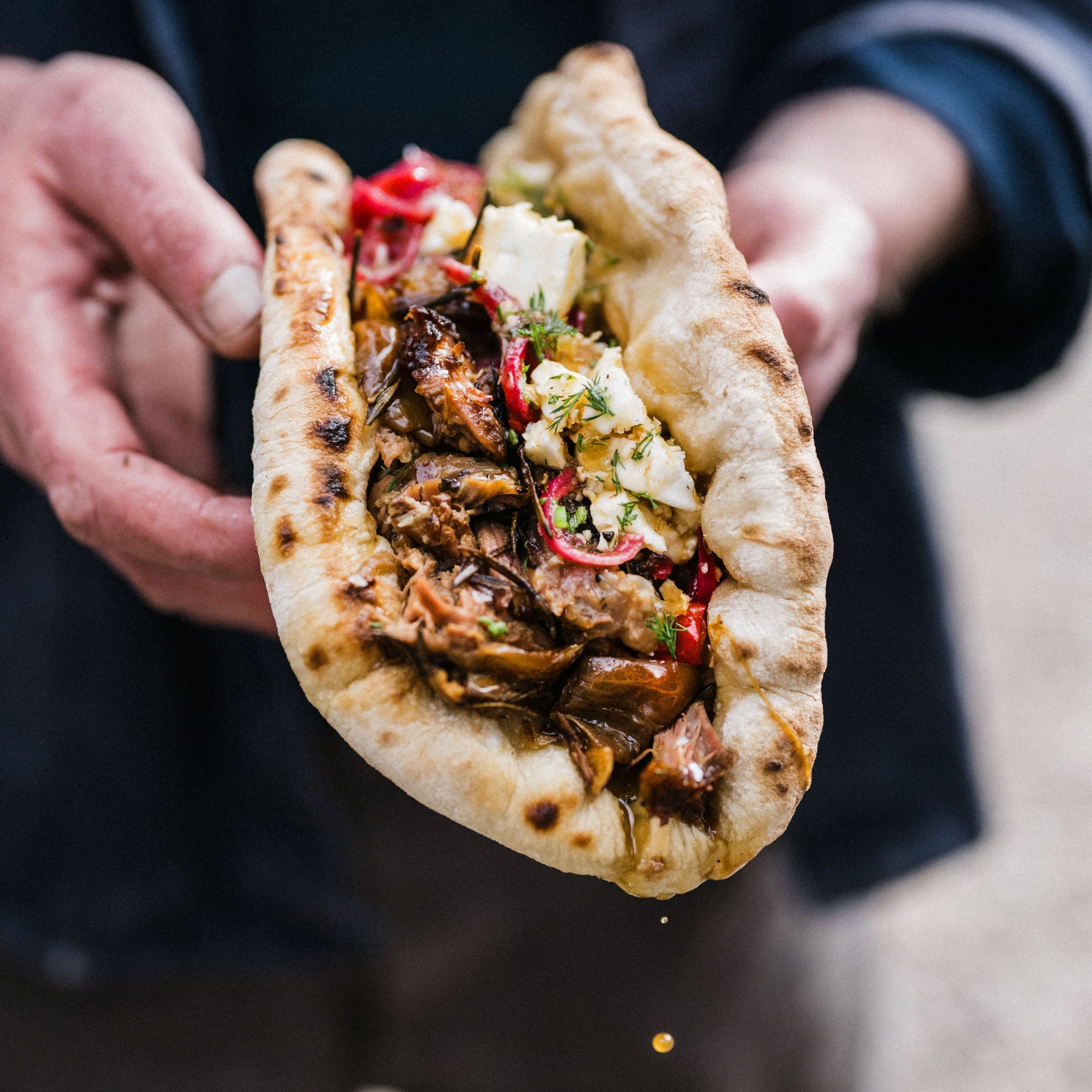 Slow roast hogget flatbreads with rhubarb hot sauce, feta, dill and honey