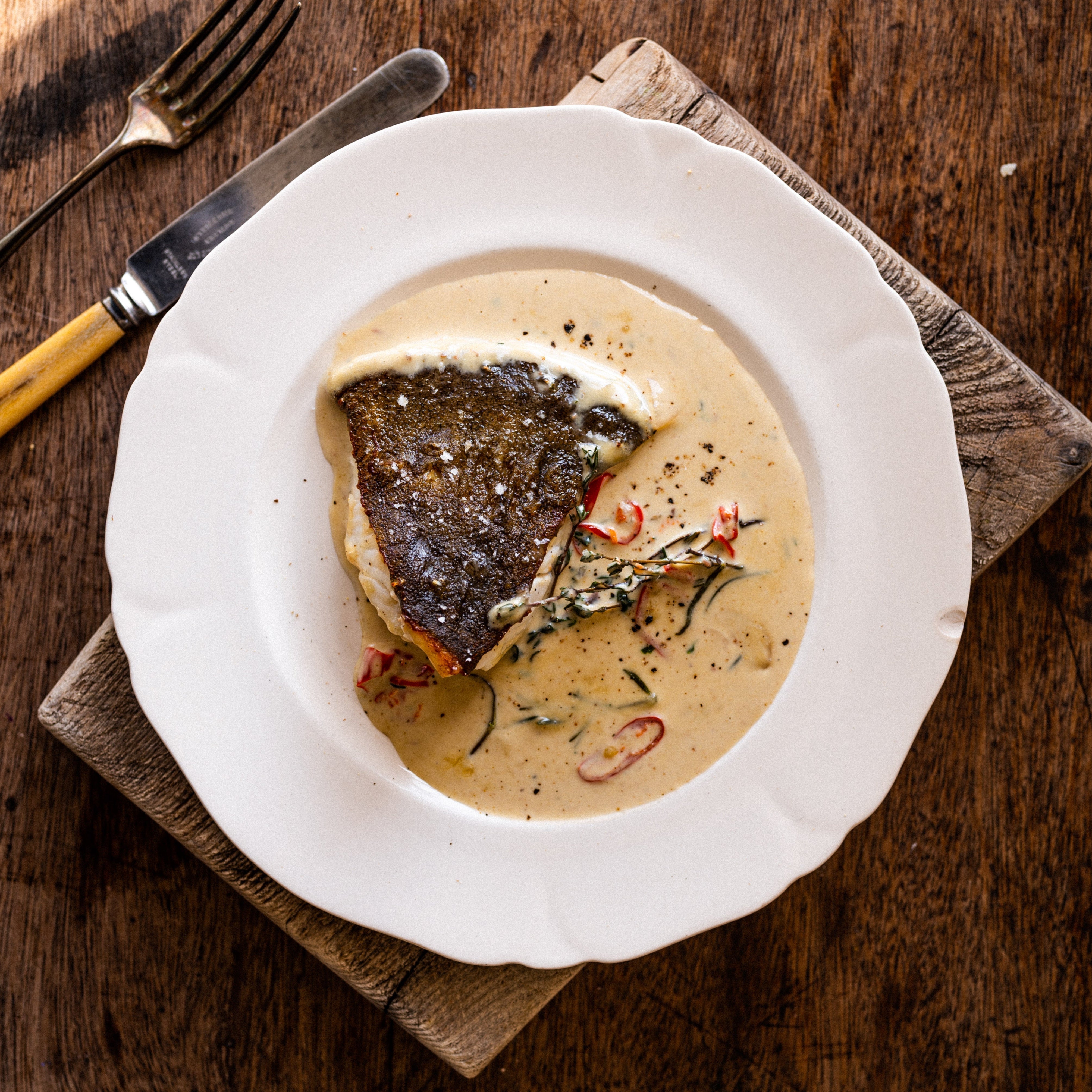 Brill with anchovies, cream and rosemary