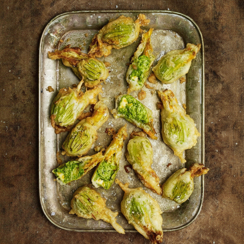 Courgette flowers filled with peas, dill and mint