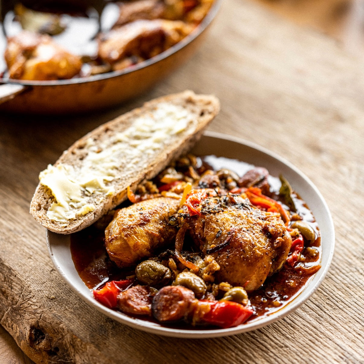 Chicken with green olives, preserved lemon, peppers, smoked paprika, oregano and spelt