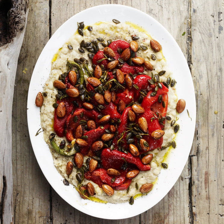 Red peppers with smashed white beans, roasted nuts and pumpkin seeds