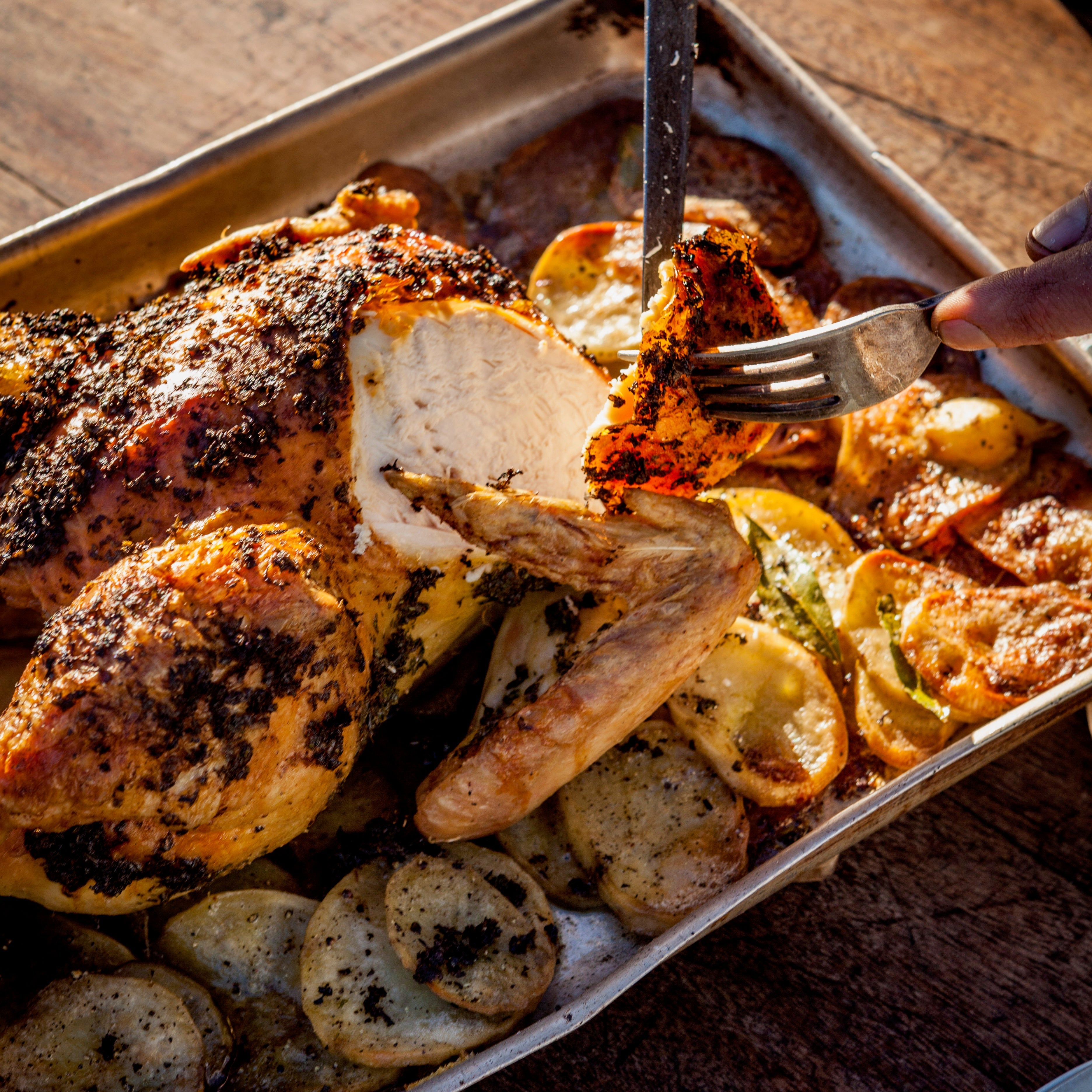 Wood-roast chicken with potatoes and herbs