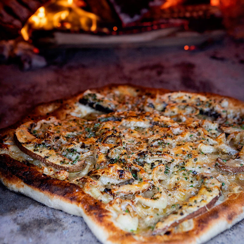 Wild mushroom pizza with Parmesan, truffle oil and chives