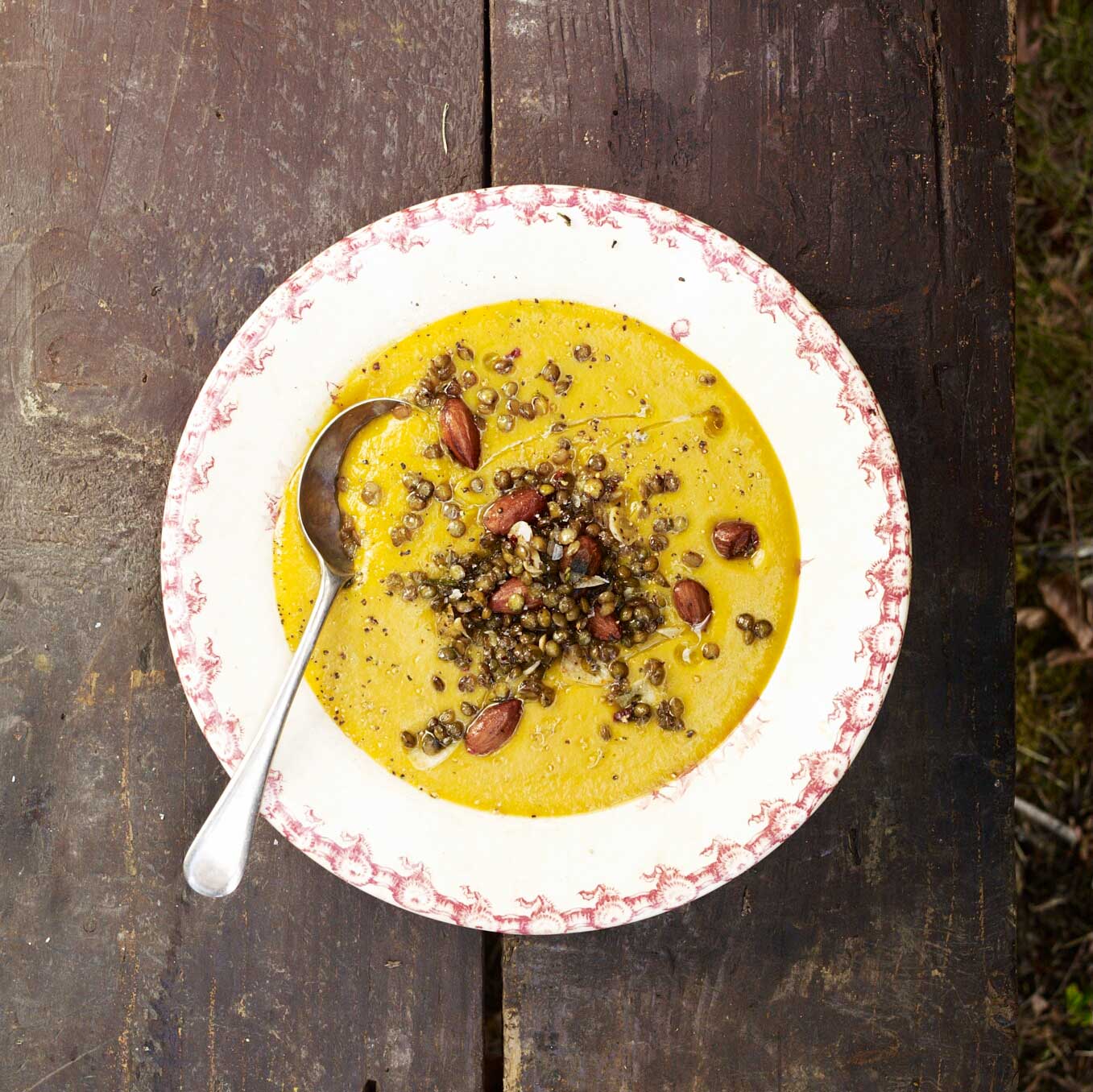 Carrot soup with lentils, salted almonds, chilli and rosemary