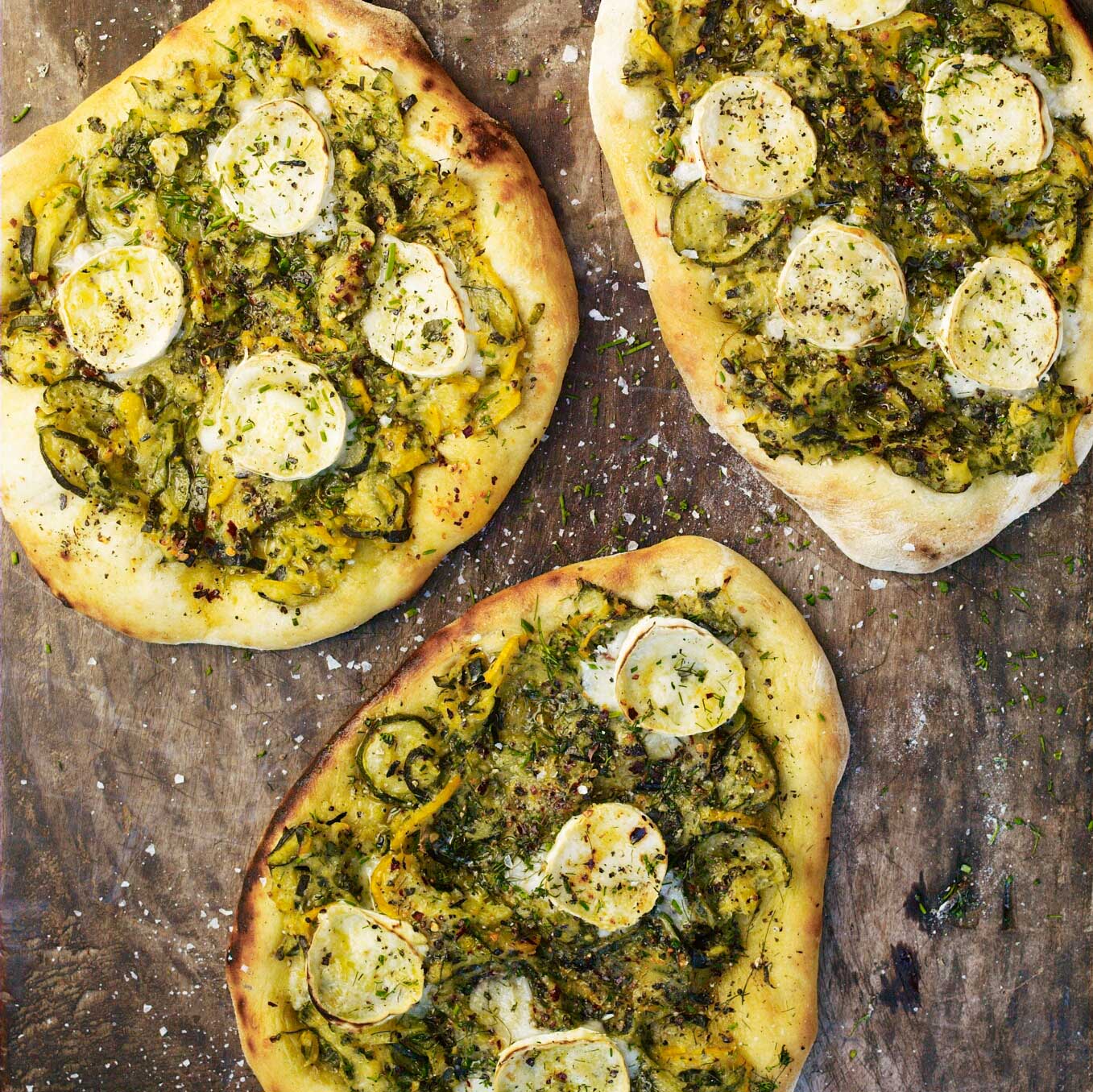 Courgette flatbreads with lots of herbs and goat’s cheese