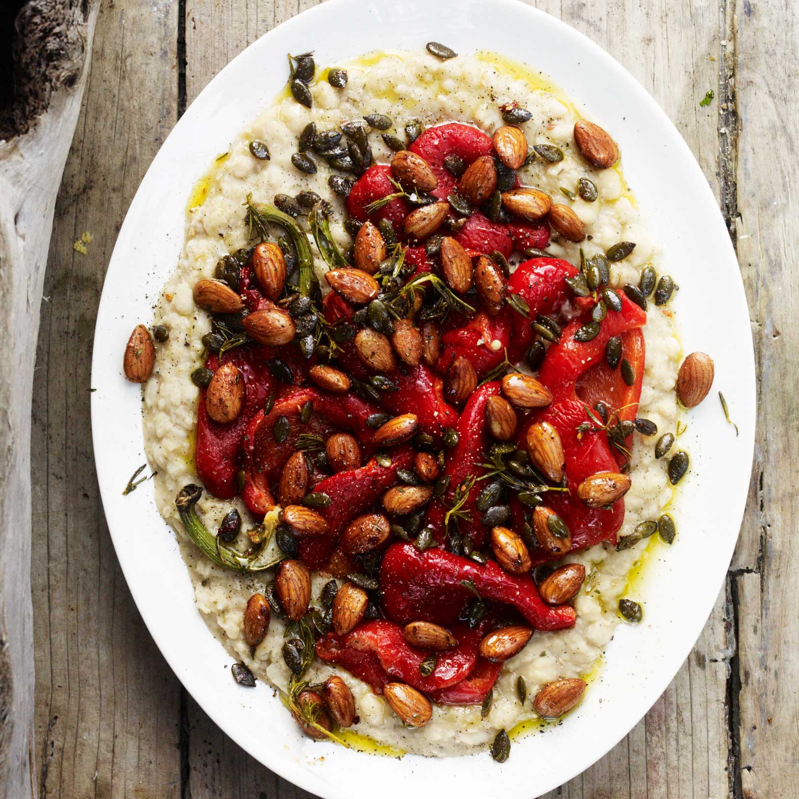 Red peppers with smashed white beans, roasted nuts and pumpkin seeds