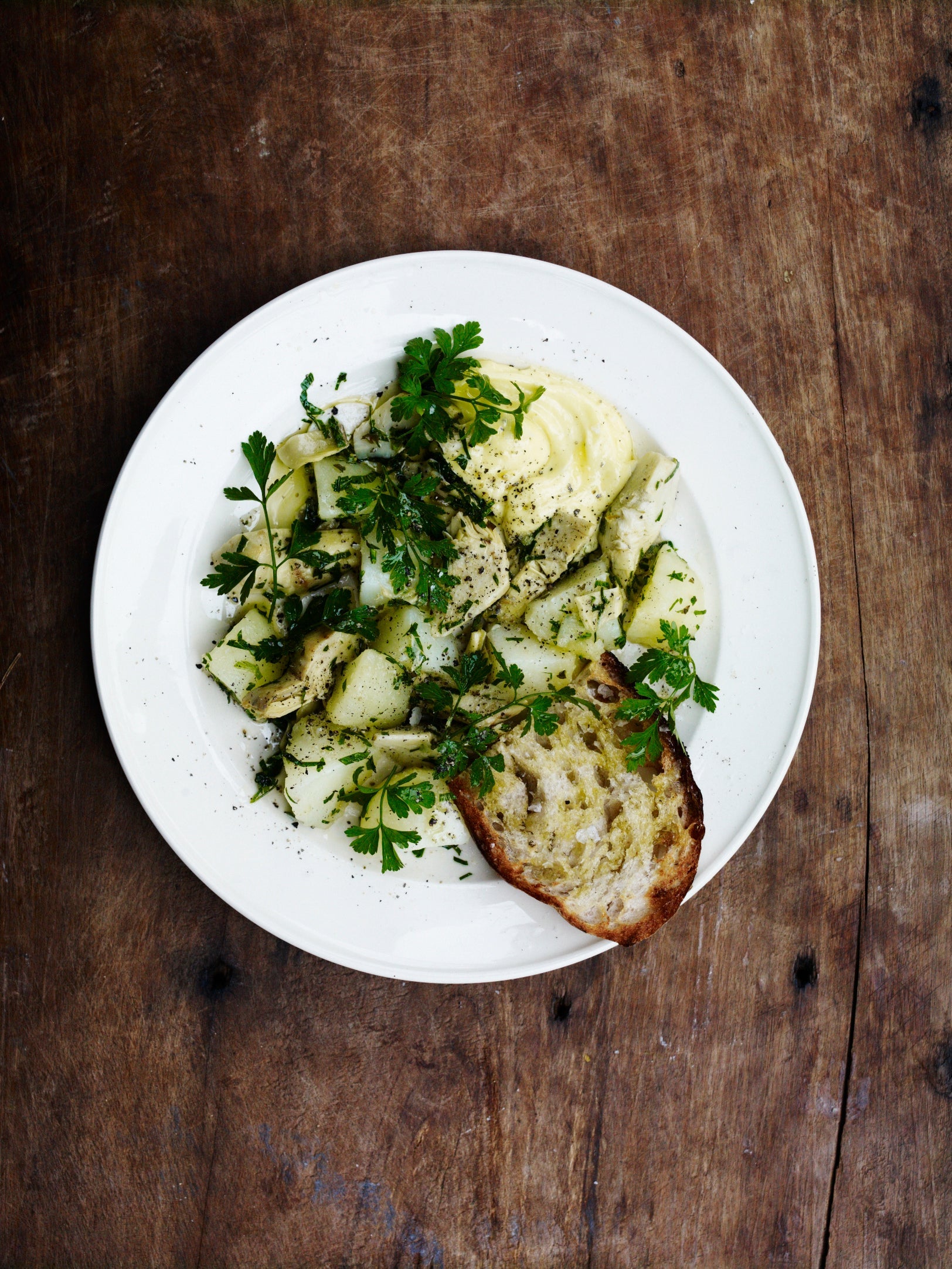 Artichokes and new potatoes with garlic mayonnaise and toast