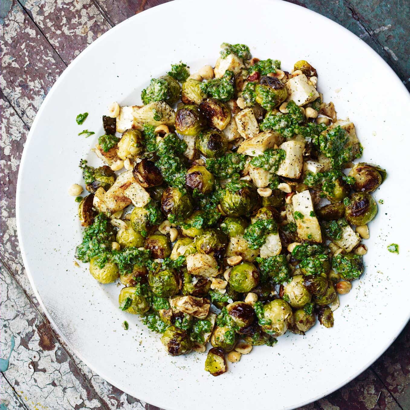 Roast sprouts and celeriac with hazelnuts and green herb sauce