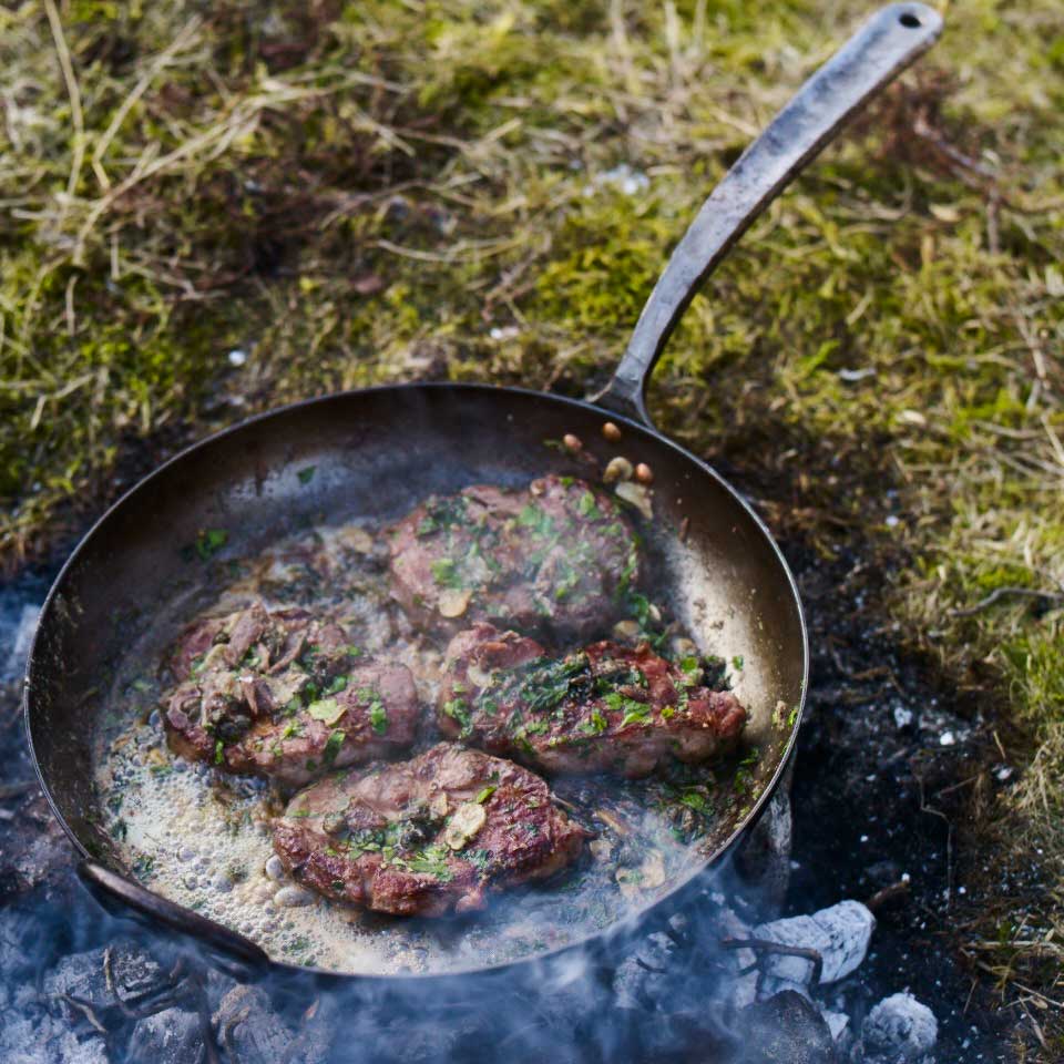 Pork shoulder steaks with chilli, garlic, capers and anchovies