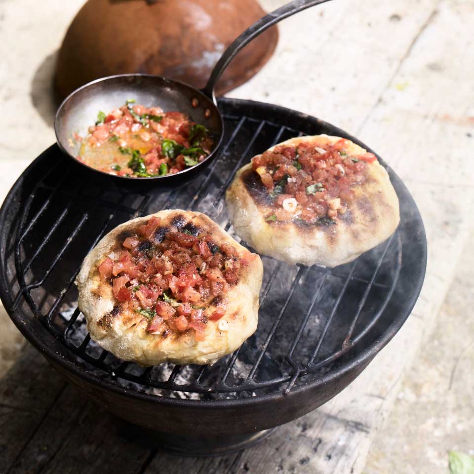 Fire breads with tomato, extra-virgin olive oil, garlic and basil