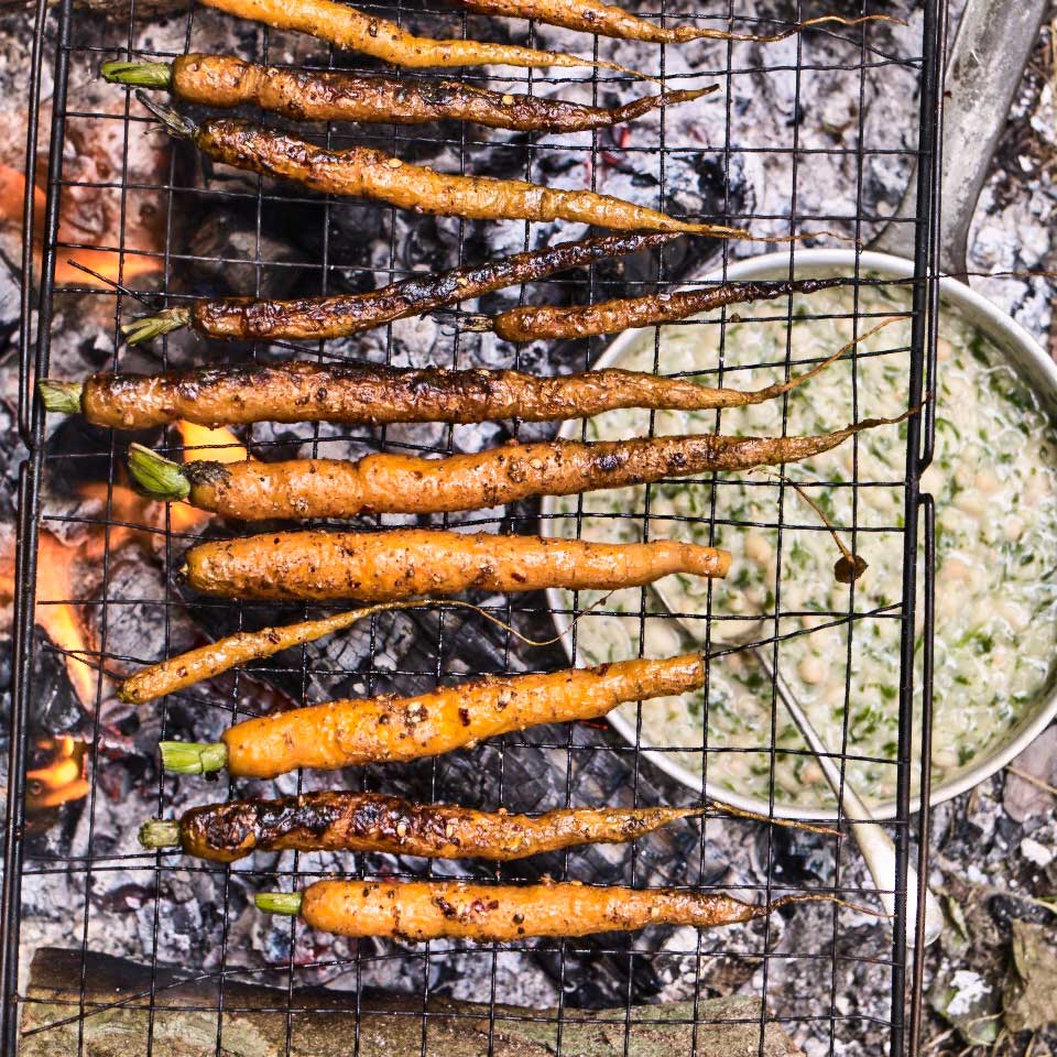 Grilled carrots with sumac, chilli, lemon and bashed herby haricot beans
