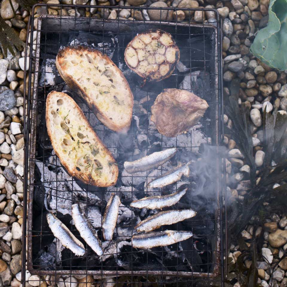 Smoky anchovies with baked wet garlic