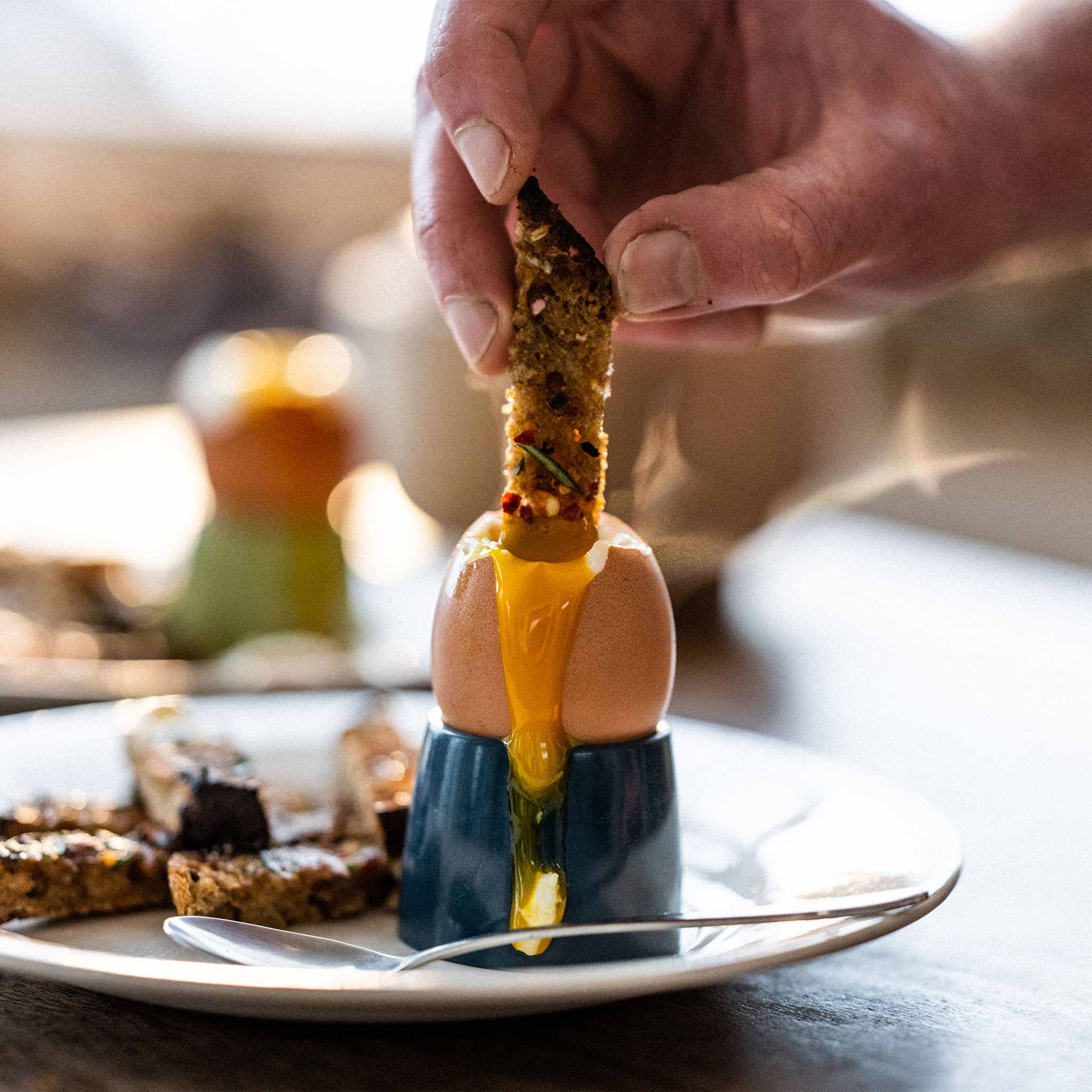 Dippy eggs with anchovy, chilli and rosemary soldiers