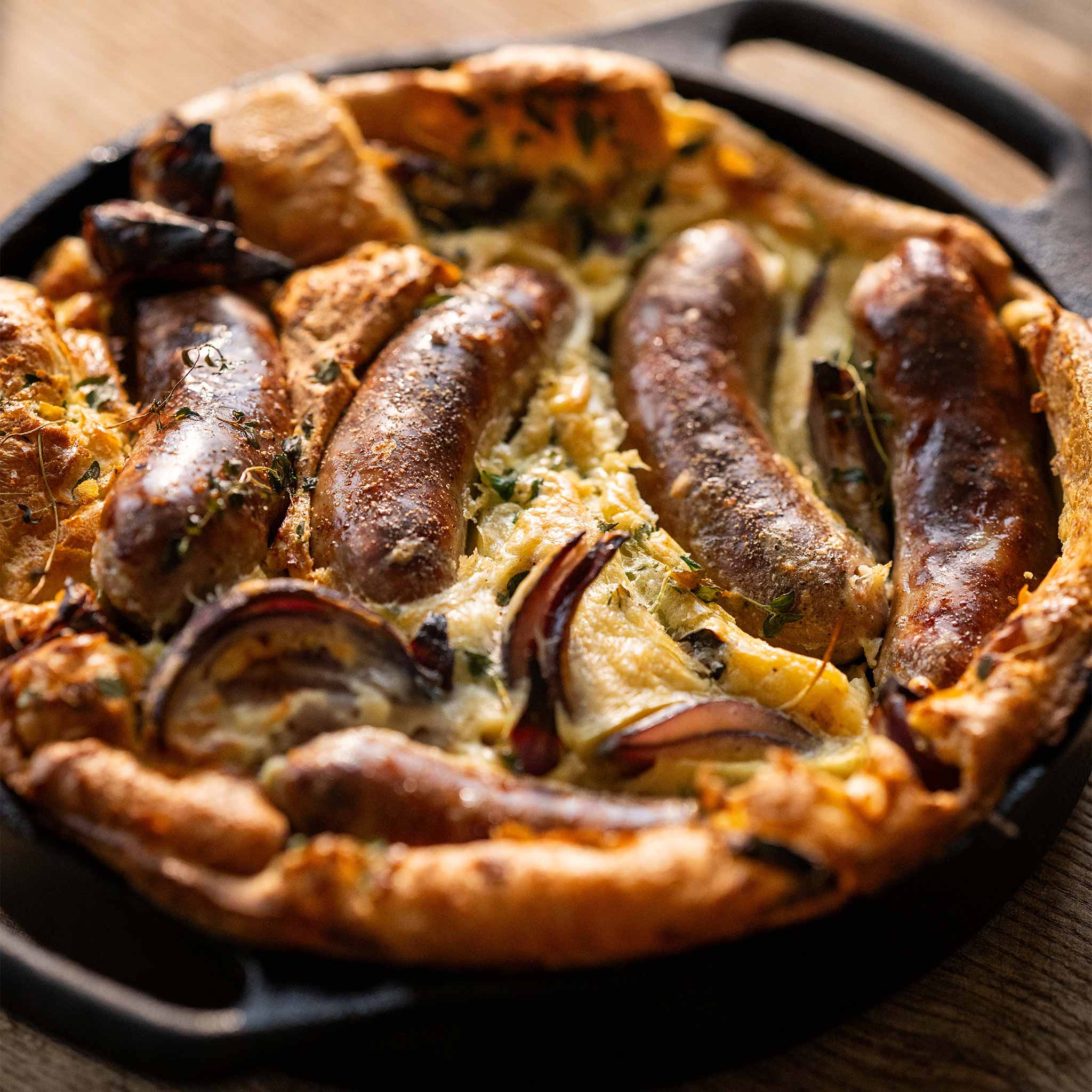 Toad in the hole with red onions and sage