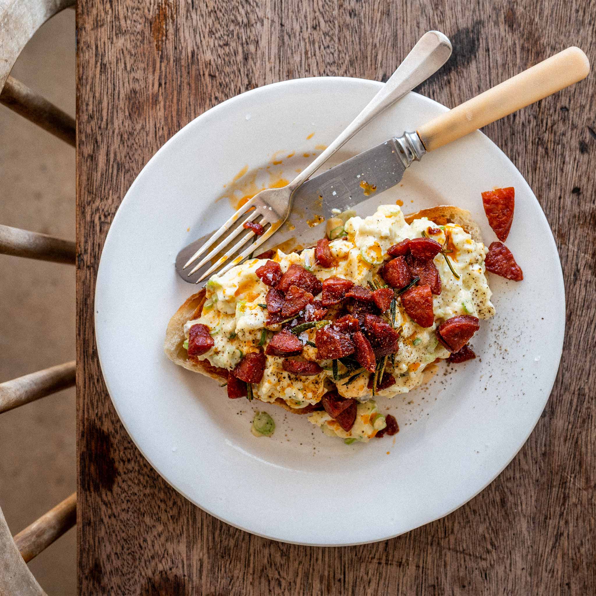 Warm eggs mayonnaise with spicy chorizo, rosemary and garlic