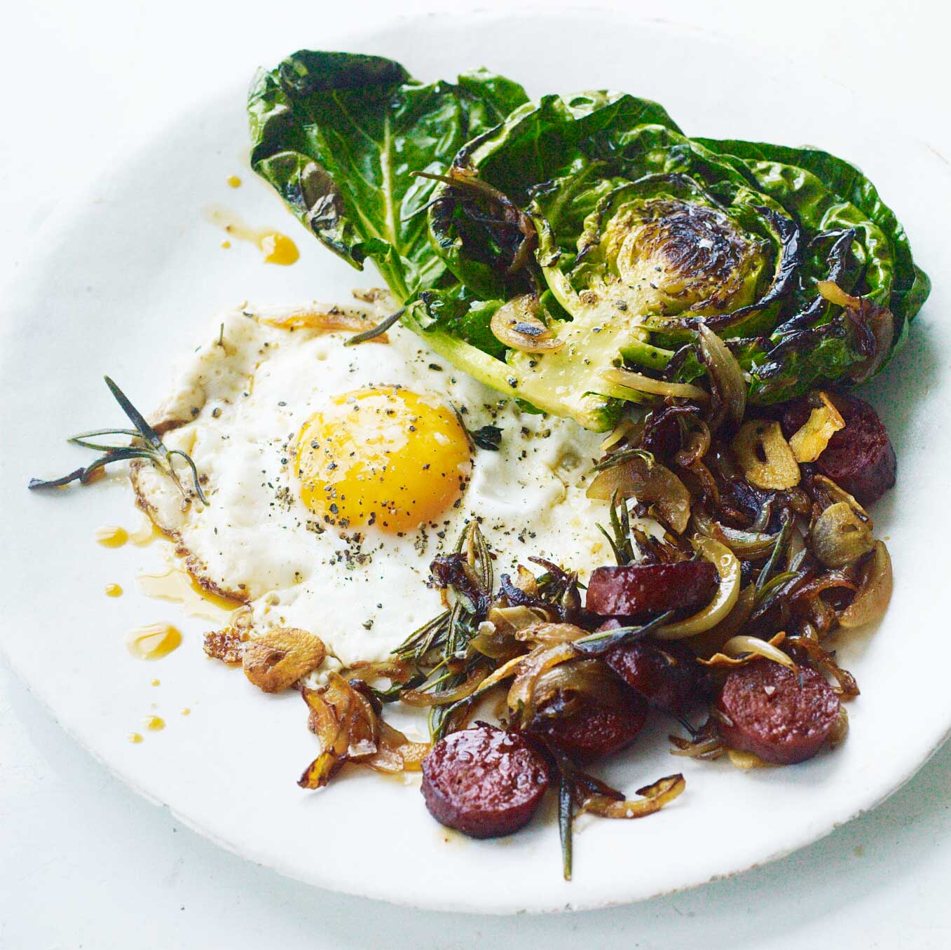 Brussels tops, chorizo, onions & fried egg