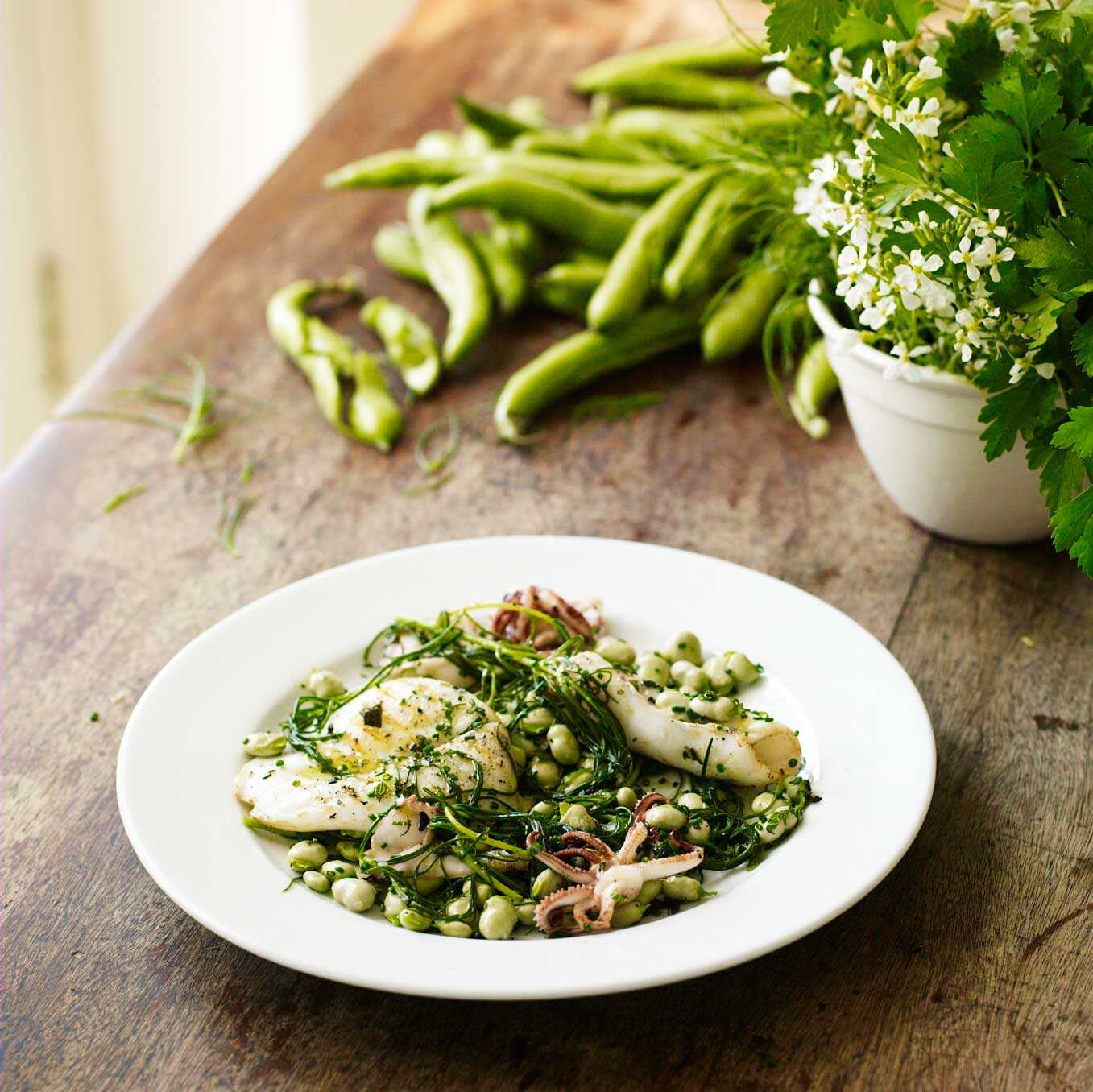Grilled squid with broad beans, mint, lemon & agretti