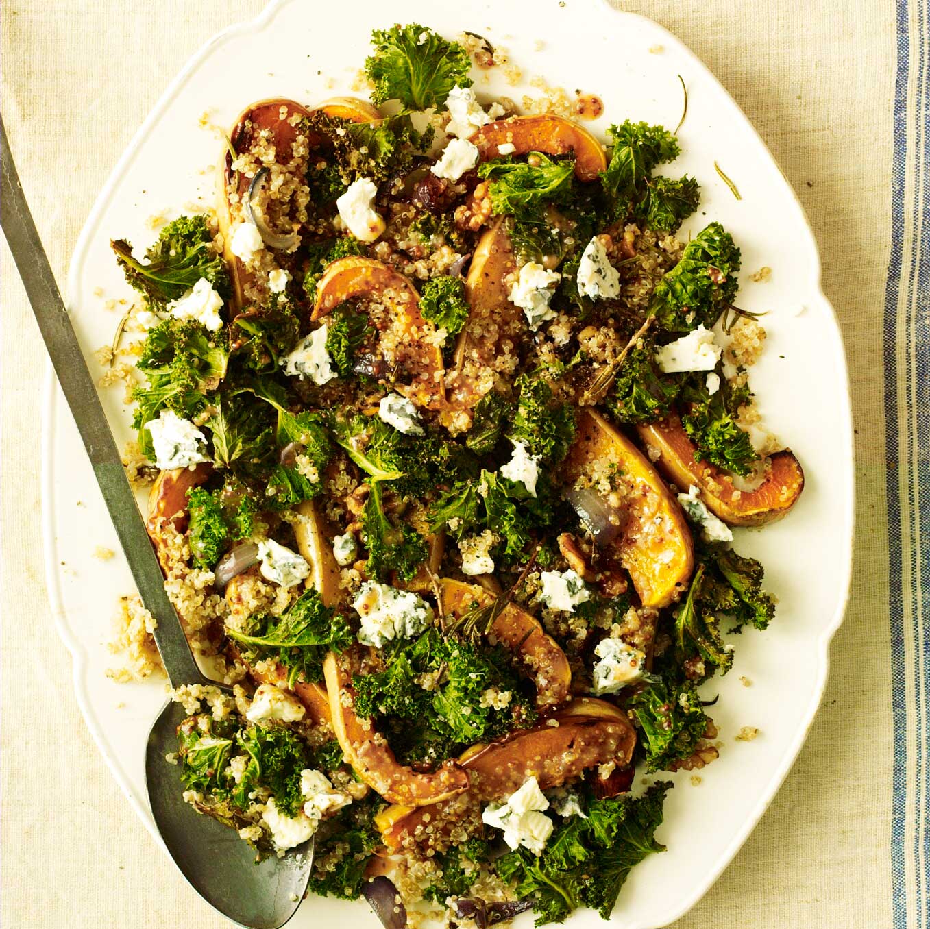 Quinoa salad with roasted squash, kale, walnuts, garlic & red-wine dressing
