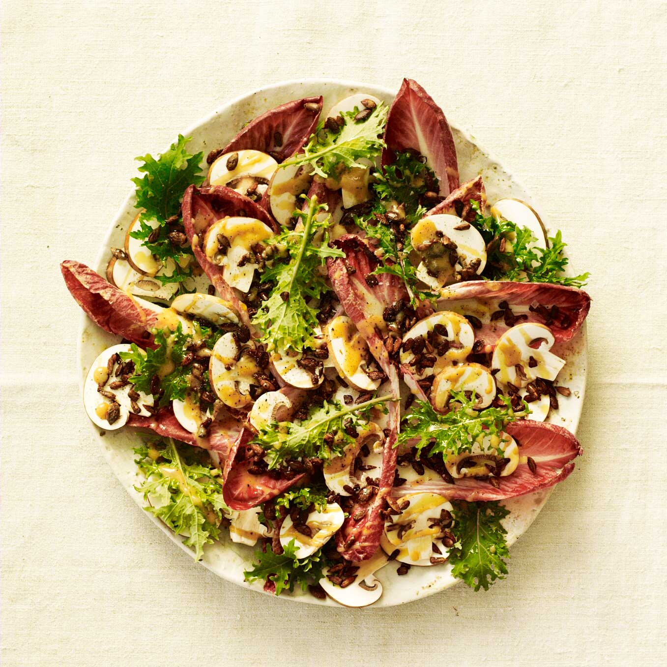 Salad of chicory, chestnut mushrooms, kale & toasted seeds