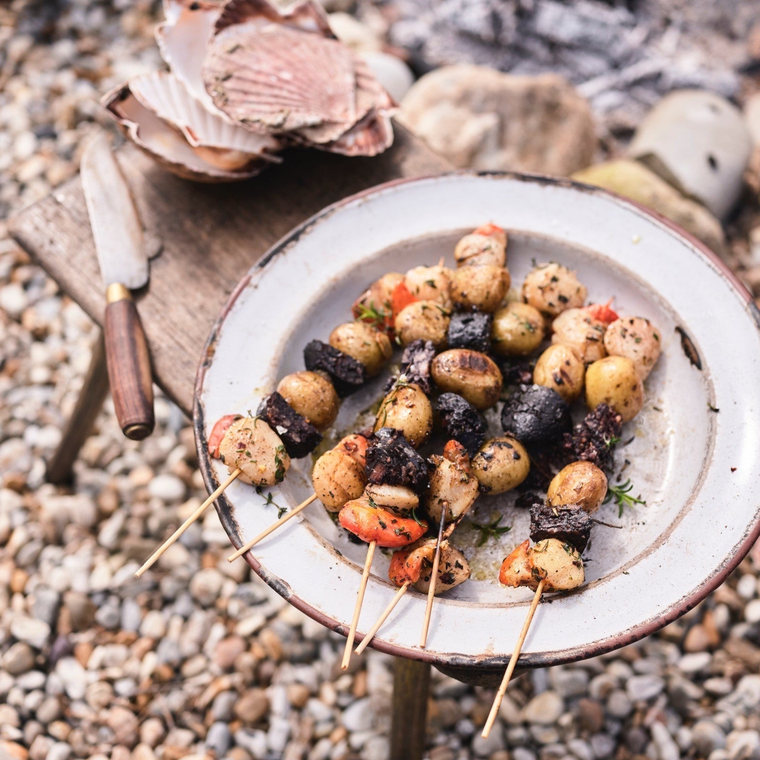 New potato, morcilla and scallop kebabs